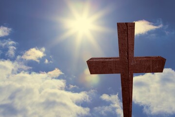 Tall wooden cross is standing against bright sky in 3D render, with sun and lens flare