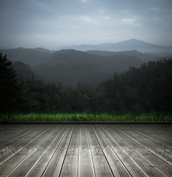 Fototapeta Wooden planks against mountains