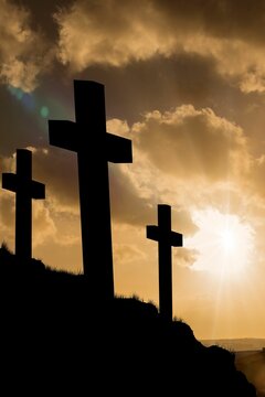 Fototapeta Cross religion symbol shape over sunset sky