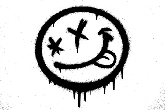 Graffiti Spray Paint Black Smiley Face with Tongue on White Wall