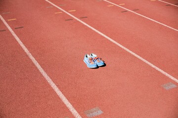 Focus of trainers on a athletics track