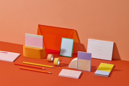 An array of colorful stationery items, pencils and notebooks