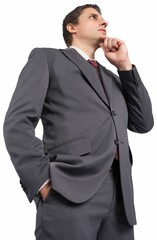 Thoughtful businessman with hand on chin