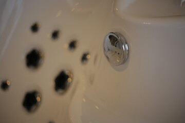 Chrome Details on White Jacuzzi Tub