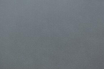 Flat design showing subtle speckled grey wall featuring gentle tonal variations, copy space