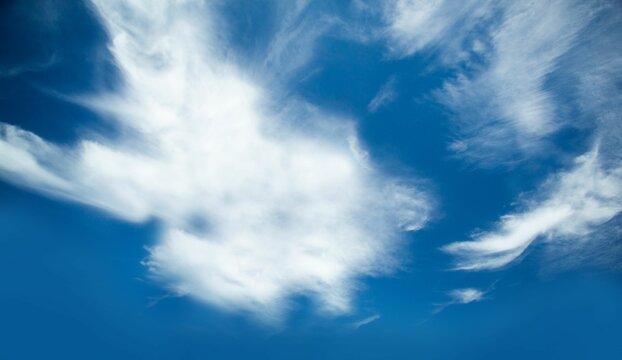 Fototapeta Low angle of blue sky with clouds