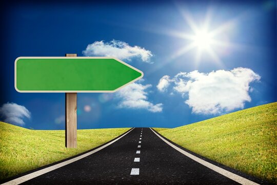 Fototapeta Asphalt road is stretching flanked by grassy hills with post holding green arrow sign, flat design