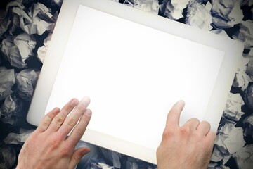 Hands touching tablet screen