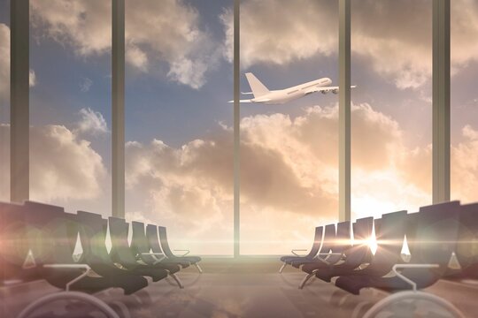 Fototapeta Airplane flying past departures lounge window