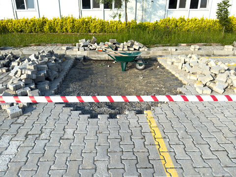 Urban Construction Zone with Paving Stones and Wheelbarrow