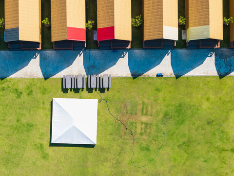 Aerial View of Campsite Cabins and Lawn with Tents
