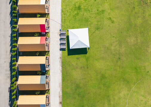 Aerial View of Campsite with Cabins and Tent