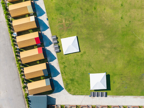 Aerial View of Camping Area with Tents and Cabins
