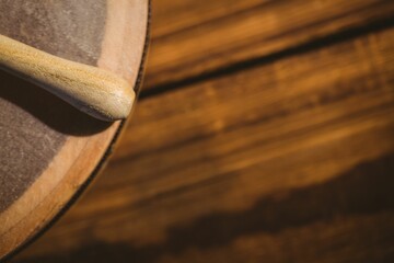 Cropped wooden stick and bodhran