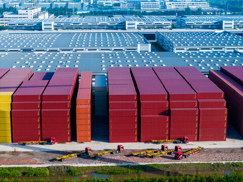 Aerial View of Neatly Arranged Shipping Containers and Parked Containe