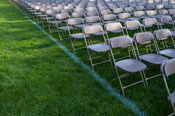 Rows of empty chairs at college graduation ceremony