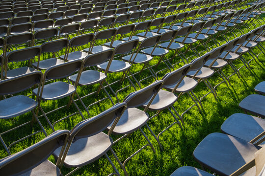 Rows of empty chairs at college graduation ceremony