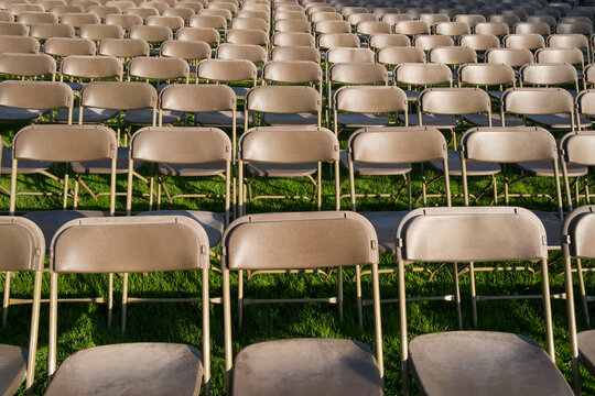Rows of empty chairs at college graduation ceremony