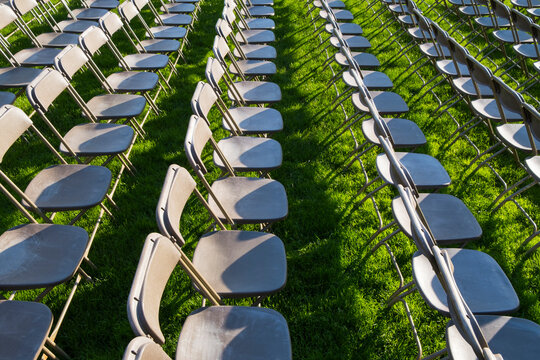 Rows of empty chairs at college graduation ceremony