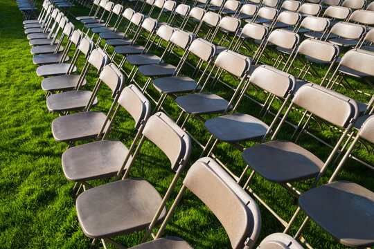 Rows of empty chairs at college graduation ceremony