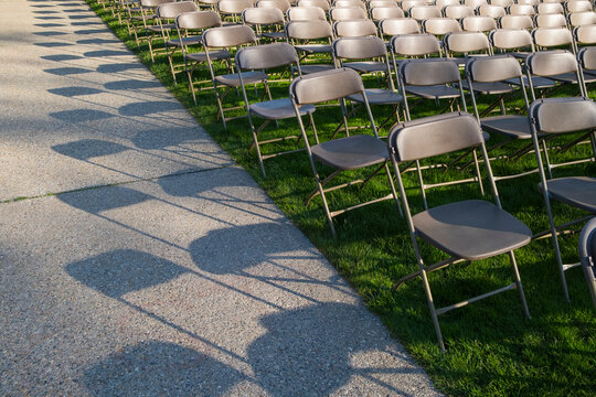 Rows of empty chairs at college graduation ceremony