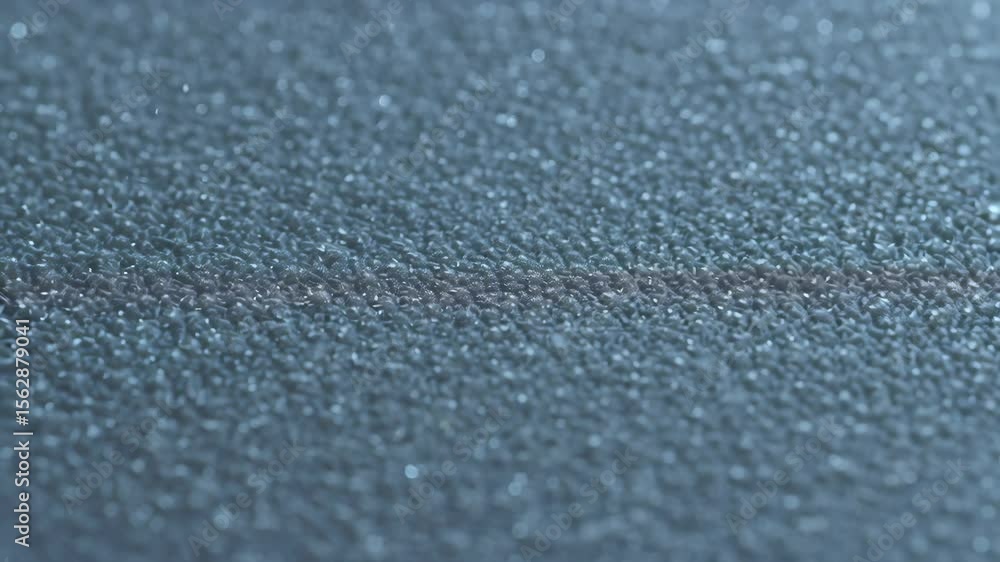 Aufkleber close-up texture of a smooth blue surface with a subtle shimmer, showcasing light reflections and so