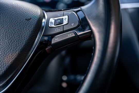 Steering wheel buttons. Modern car interior. Driving control technology.