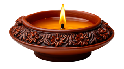 Ornate terracotta oil lamp with a burning flame and floral carvings isolated on transparent background