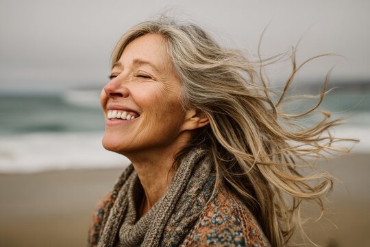 Woman laughing on beach