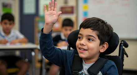 Smiling boy in wheelchair raising hand in classroom with classmates. Student with disability for inclusive education and accessibility programs