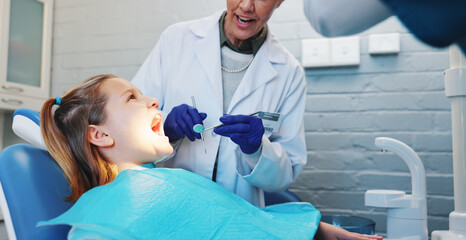Consulting, dentist and child with woman in office for oral hygiene, healthcare and mouth. Teeth cleaning, medical and orthodontist appointment with kid and person in dental clinic for treatment