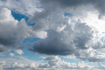 Dramatic sky with fluffy and dark clouds