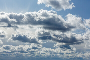 Dramatic cloudy sky with sunlight filtering through
