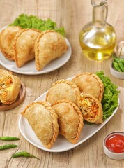 Pastel Goreng in Indonesia, pastel refers to a type of kue filled with meat, vegetables, and rice vermicelli deep fried in vegetable oil. Similar Empanadas