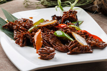 Scallion ribs on a square porcelain plate