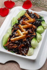 White round porcelain plate with small stir-fried beef