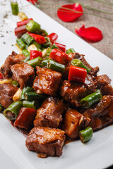 Black iron pot with spicy chicken nuggets