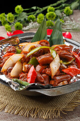 Black casserole with tin foil casserole stewed pig tail