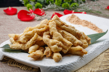 Fried seafood minced meat in a white oval porcelain plate
