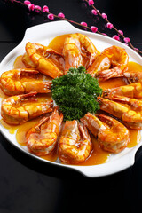 Kung Pao large shrimps on a white porcelain plate