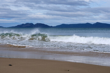 Sea splash on a shallow beach - Swansea, Tasmania, Australia