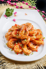 Kung Pao large shrimps on a white porcelain plate