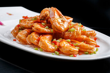 Kung Pao large shrimps on a white porcelain plate