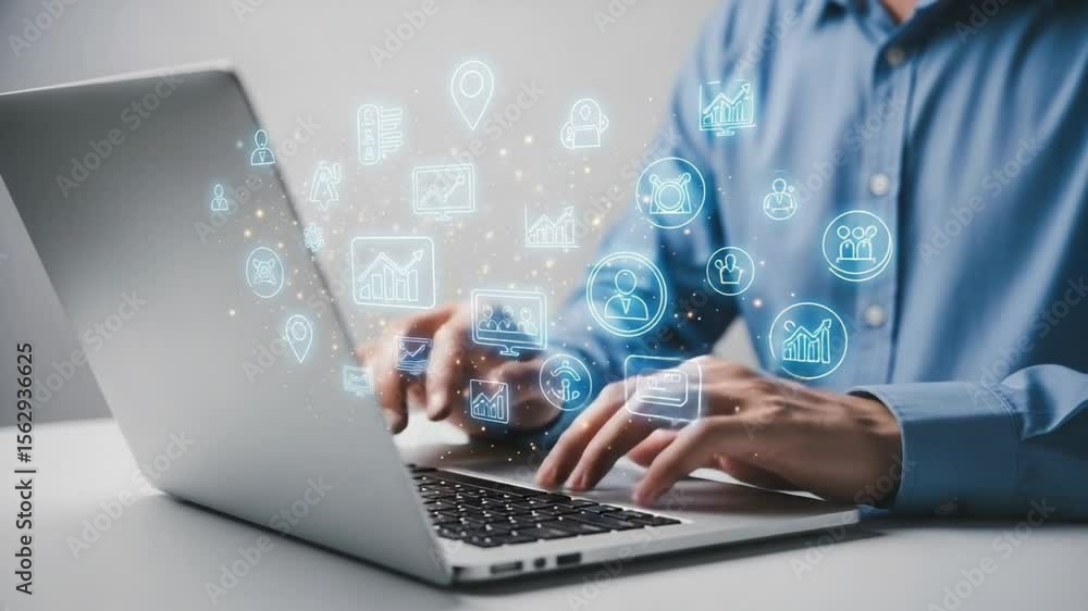 Poster man typing on laptop with digital icons floating above the keyboard in a modern office space