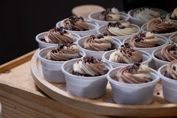 chocolate cupcakes on wooden plate in wedding party reception