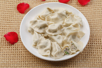 Fresh seafood dumplings on a white porcelain plate