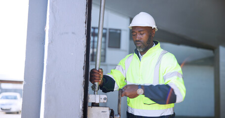 Mature man, garage door and open for distribution, freight or storage at warehouse for supply...