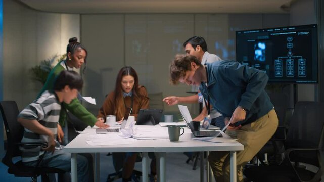 Fast-paced timelapse of diverse programmers and developers in a startup office, brainstorming, coding, and discussing business strategy Time-lapse of a busy corporate office at night, Programmer