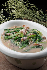 Seafood, Chinese cabbage and sea hare stew served on an oval white porcelain plate