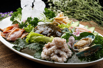 Jiaodong seafood sashimi platter on an oval white porcelain plate